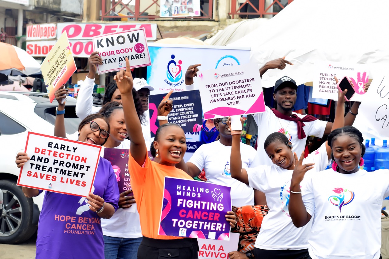 Volunteers raising cancer awareness at a community market outreach